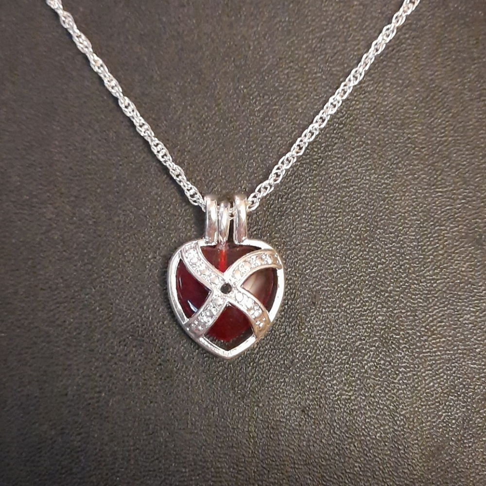 Classic Sterling Heart with Design on 18 in chain.